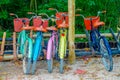 TULUM, MEXICO - JANUARY 10, 2018: Outdoor view of five bikes parked in a row in the enter of Mayan ruins of Tulum in Royalty Free Stock Photo