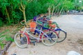 TULUM, MEXICO - JANUARY 10, 2018: Outdoor view of some bikes parked in a row in the enter of Mayan ruins of Tulum in Royalty Free Stock Photo