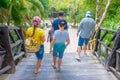 TULUM, MEXICO - JANUARY 10, 2018: Unidentified people walking over a wooden brindge in an ecological path in Mayan ruins Royalty Free Stock Photo