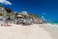 TULUM, MEXIO - FEB 29, 2016: Tourists at the beach under the ruins of the ancient Maya city Tulum, Mexi Royalty Free Stock Photo