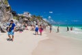 TULUM, MEXIO - FEB 29, 2016: Tourists at the beach under the ruins of the ancient Maya city Tulum, Mexi Royalty Free Stock Photo