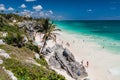 TULUM, MEXIO - FEB 29, 2016: Tourists at the beach under the ruins of the ancient Maya city Tulum, Mexi Royalty Free Stock Photo