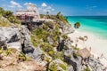 TULUM, MEXIO - FEB 29, 2016: Tourists at the beach under the ruins of the ancient Maya city Tulum, Mexi Royalty Free Stock Photo