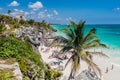 TULUM, MEXIO - FEB 29, 2016: Tourists at the beach under the ruins of the ancient Maya city Tulum, Mexi Royalty Free Stock Photo