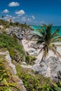 TULUM, MEXIO - FEB 29, 2016: Tourists at the beach under the ruins of the ancient Maya city Tulum, Mexi Royalty Free Stock Photo