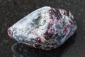 Tumbled Almandine garnet crystals on dark Royalty Free Stock Photo