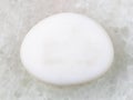 tumbled cacholong (white opal) gemstone on white Royalty Free Stock Photo