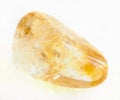 tumbled Citrine (yellow quartz) stone on white