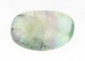 tumbled fluorite (fluorspar) stone on white