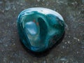 tumbled heliotrope gemstone on dark background