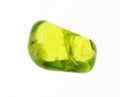 tumbled olivine (chrysolite, peridot) gem on white Royalty Free Stock Photo