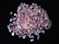 Tumbled rose quartz, on a black background