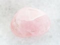 tumbled Rose Quartz gem stone on white marble Royalty Free Stock Photo