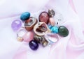 Tumbled and rough gemstones and crystals of various colors. Amethyst, rose quartz, agate, apatite, aventurine, olivine, turquoise