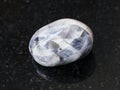 tumbled Tamerlane Stone (amethyst quartz) on dark
