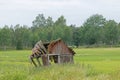 Tumbledown barn on a field Royalty Free Stock Photo