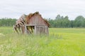 Tumbledown barn on a field Royalty Free Stock Photo