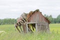 Tumbledown barn on a field Royalty Free Stock Photo