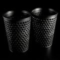 Tumblers with intricately etched designs on black glass Royalty Free Stock Photo