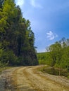 The Tumbling of road beside declivity of mountain Royalty Free Stock Photo