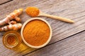 Tumeric powder and bottle of turmeric essential oil extracted Royalty Free Stock Photo