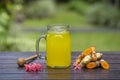 Tumeric ginger lemon drink in a jar