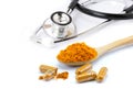 Tumeric powder capsules Royalty Free Stock Photo