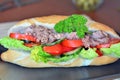Tuna Baguette With Vegetables On The Brown Plate