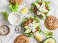 Tuna burger on a light background, top view. Burger with tuna, avocado and mustard sauce,