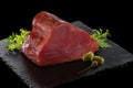 Tuna fillet on a square stone plate Royalty Free Stock Photo