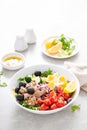 Tuna and fresh vegetable salad of tomato, cucumber, olives, onion, lettuce and boiled egg Royalty Free Stock Photo