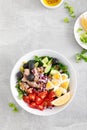 Tuna and fresh vegetable salad of tomato, cucumber, olives, onion, lettuce and boiled egg Royalty Free Stock Photo