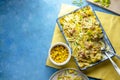 Tuna Pasta Bake with sweet corn. One pan easy, comfort food, blue background. Copy space