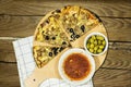 tuna pizza with cheese and tomato and olives with tomato bowl on cutting wooden Royalty Free Stock Photo