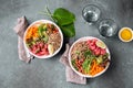 Tuna poke bowl with quinoa and vegetales. budda bowl. Quinua tuna salad on gray background Royalty Free Stock Photo