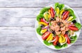 Tuna salad with anchovies, eggs, black olives, tomatoes, oil, basil, garlic, vinegar Royalty Free Stock Photo