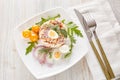 Tuna salad with rice, arugula and tomatoes on light wooden background. Healthy food, seafood menu Royalty Free Stock Photo