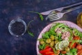 Tuna salad with tomatoes, olives, cucumber, sweet pepper and arugula Royalty Free Stock Photo