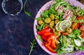 Tuna salad with tomatoes, olives, cucumber, sweet pepper and arugula Royalty Free Stock Photo