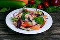 Tuna salad with vegetables. on old wooden table