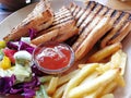 Tuna Sandwich This is a Mediterranean tuna sandwich. grilled and garnished with fresh salad and French fries