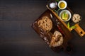 Tuna spread with fresh bread slice, sage butter, olive oil and salt on rustic wooden table Royalty Free Stock Photo