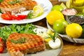 Tuna steak cooked on the electric grill. tunafish served on a plate with fresh herbs and vegetables. healthy nutritious