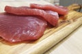 Tuna steak on a wooden board, tasty fish dinner
