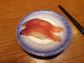 Tuna sushi on small plate. Popular conveyor belt sushi restaurant in Seoul. Royalty Free Stock Photo