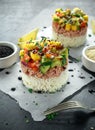 Tuna sushi stacks with mango, cucumber, tomatoes salsa served with balsamic vinegar, nigela ans sesame seeds Royalty Free Stock Photo