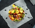 Tuna sushi stacks with mango, cucumber, tomatoes salsa served with balsamic vinegar, nigela ans sesame seeds Royalty Free Stock Photo