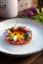 Tuna Tartar with Avocado on white plate