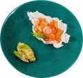 Tuna Tartar with guacamole sauce and crackers on green plate isolated Royalty Free Stock Photo