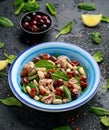 Tuna, white bean salad with olive, red onion, spinach and dried tomato. Healthy food. Royalty Free Stock Photo